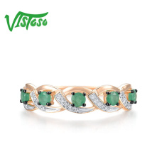 Minimalistický prsten s propletením zdobený smaragdy