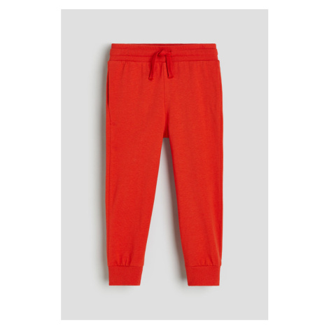 H & M - Žerzejové kalhoty jogger - oranžová H&M