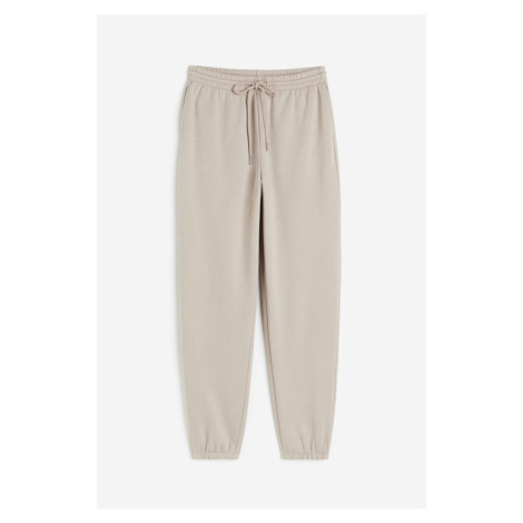 H & M - Teplákové kalhoty z bavlněné směsi - hnědá H&M