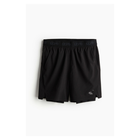 H & M - Sportovní šortky 2-v-1 z DryMove™ čtyřsměrný streč - černá H&M