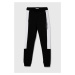 Dětské bavlněné tepláky Calvin Klein Jeans černá barva