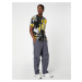 Koton Parachute Trousers with a loose fit, lacing at the waist, and elasticated legs with a pock