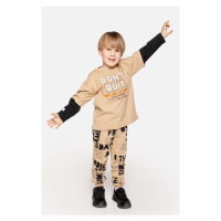 Dětské bavlněné kalhoty Coccodrillo béžová barva, vzorované