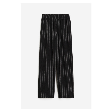 H & M - Natahovací žerzejové kalhoty - černá