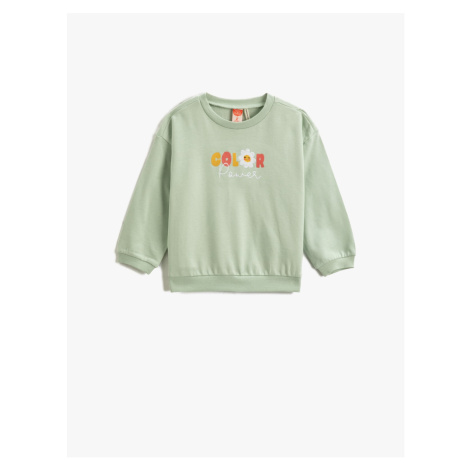 Koton Floral Print on the Back Sweatshirt with Embroidered Detail.
