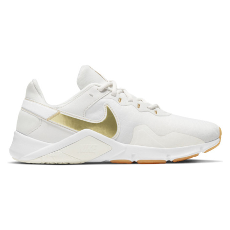 NIKE-Wmns Legend Essential 2 platinum tint/metallic gold Bílá