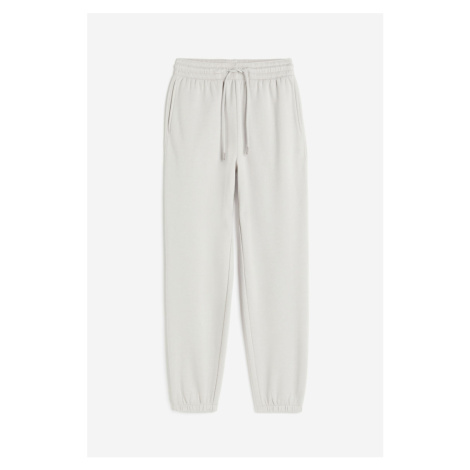 H & M - Teplákové kalhoty z bavlněné směsi - šedá H&M