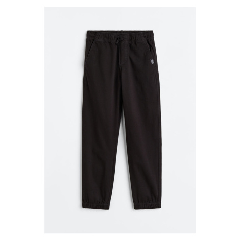H & M - Keprové kalhoty jogger - černá H&M