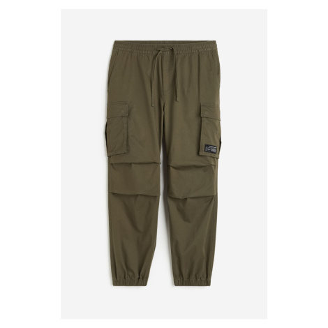 H & M - Bavlněné kalhoty cargo jogger Relaxed Fit - zelená H&M