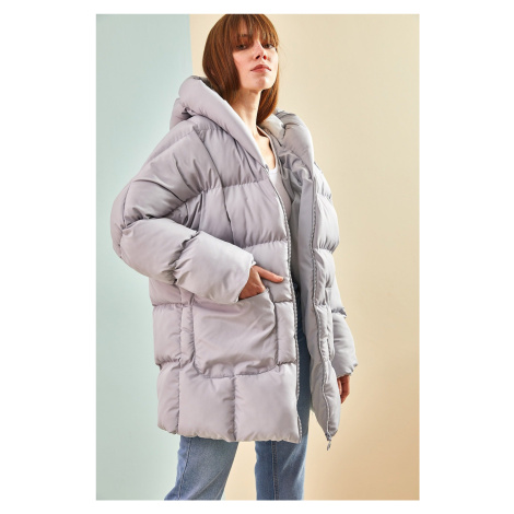 Dámský nadměrný nadýchaný kabát Bianco Lucci s dvojitými kapsami a kapucí