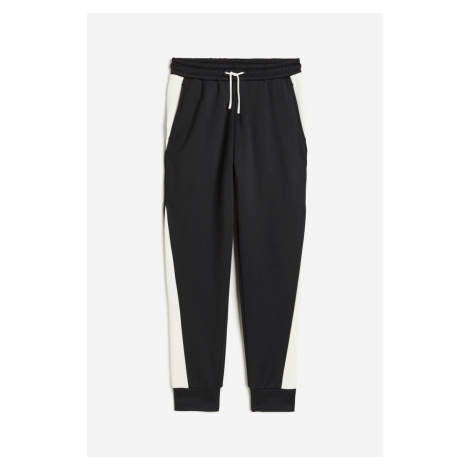 H & M - Hřejivé sportovní kalhoty jogger - černá H&M