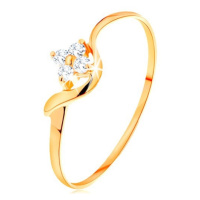 Prsten ze žlutého 14K zlata - kvítek z čirých diamantů, zvlněné rameno