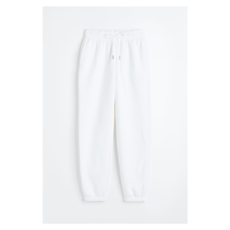 H & M - Teplákové kalhoty z bavlněné směsi - bílá H&M