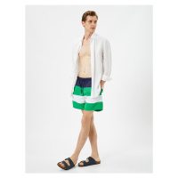 Koton Marine Shorts with Color Block with a drawstring waist and pocket.