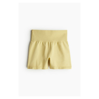 H & M - Bezešvé sportovní hotpants z materiálu DryMove™ - žlutá