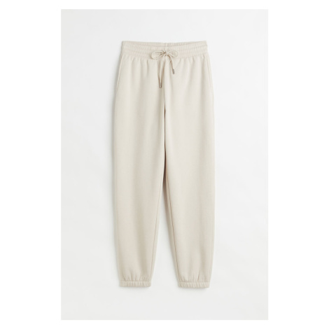 H & M - Teplákové kalhoty z bavlněné směsi - béžová H&M