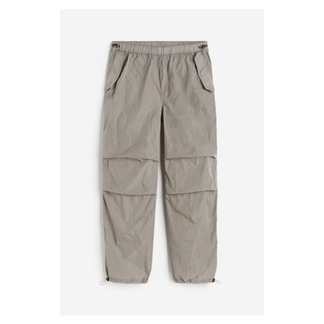 H & M - Nylonové kalhoty parachute Loose Fit - šedá H&M