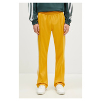 Tepláky adidas Originals 70S Track Pant žlutá barva, s aplikací, IX5223