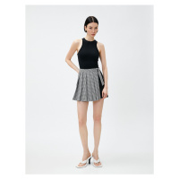 Koton Pleated Mini Skirt with Contrast Detail Belt.