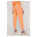 Bavlněné tepláky New Balance WP21503PGZ dámské, oranžová barva, hladké
