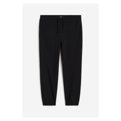 H & M - Teplákové kalhoty Relaxed Fit - černá H&M