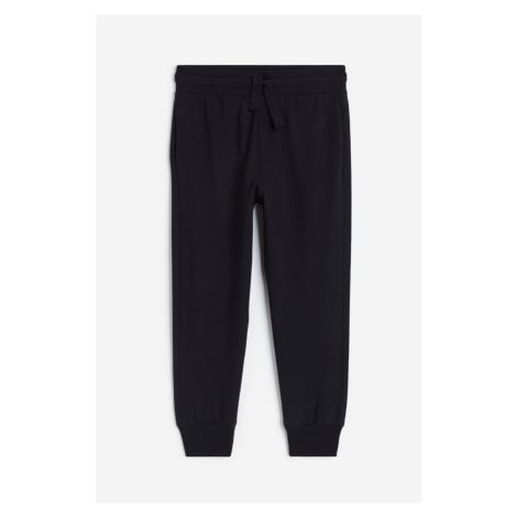 H & M - Žerzejové kalhoty jogger - černá H&M