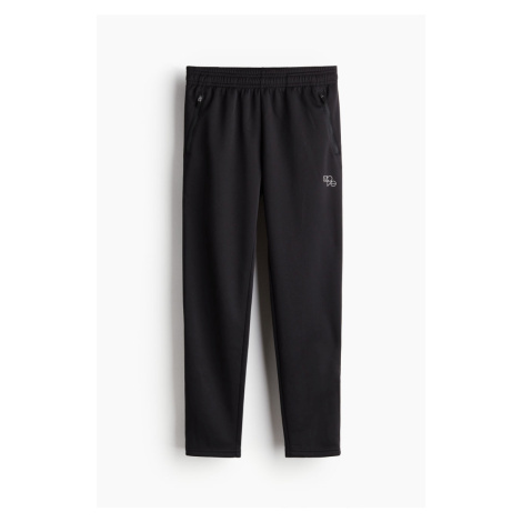 H & M - Rychleschnoucí sportovní kalhoty - černá H&M