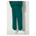 Bavlněné tepláky Puma MMQ Sweatpants zelená barva, 624007