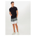 Nike Sportswear Kalhoty 'City Edition' šedá / černá / bílá