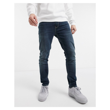 ASOS DESIGN skinny jeans in dark wash-Blue