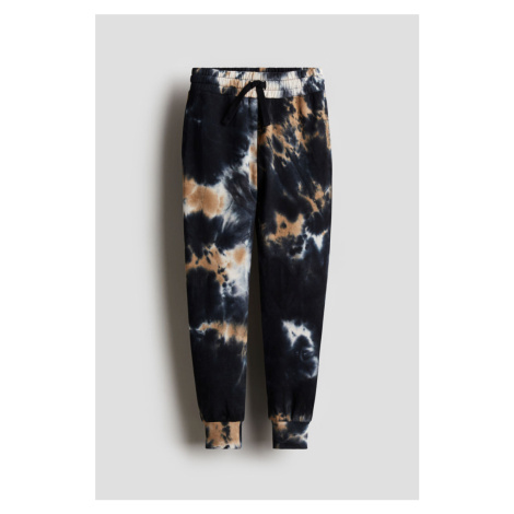 H & M - Vzorované kalhoty jogger - černá H&M