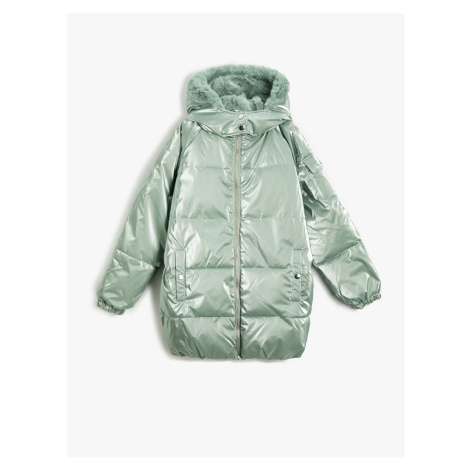 Koton Long Shiny Puffy Coat with a Hooded Faux Für Detail.