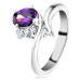 Prsten ve stříbrném odstínu, úzká zahnutá ramena, fialový broušený ovál