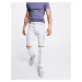 ASOS DESIGN stretch slim jeans in flat light wash blue with knee rips
