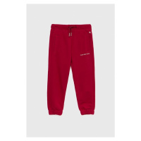 Dětské tepláky Calvin Klein Jeans růžová barva, hladké