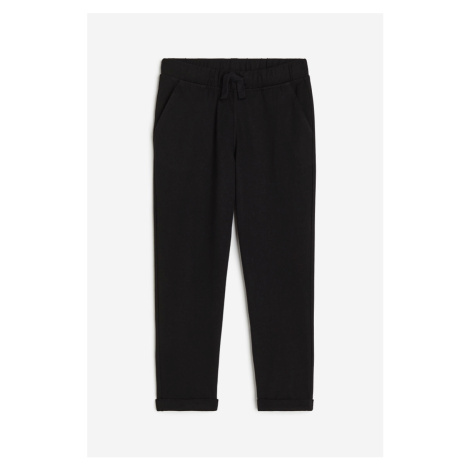 H & M - Kalhoty jogger z bavlněného žerzeje - černá H&M