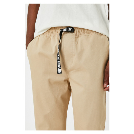Pánské béžové kalhoty Koton