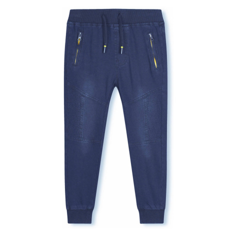 Chlapecké riflové kalhoty / tepláky KUGO CK0906, modrá / signální zipy Barva: Modrá