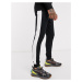 ASOS DESIGN organic skinny joggers with side stripe in black