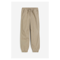 H & M - Bavlněné kalhoty jogger - hnědá