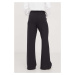 Tepláky Tommy Jeans černá barva, hladké, DW0DW17312