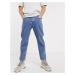 ASOS DESIGN relaxed tapered jeans in mid wash blue