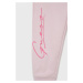Dětské bavlněné kalhoty Guess růžová barva, s potiskem