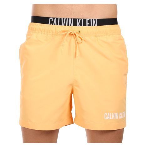 Pánské plavky Calvin Klein oranžové (KM0KM00992-SAN)