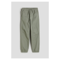 H & M - Bavlněné kalhoty jogger - zelená