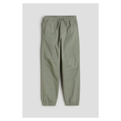 H & M - Bavlněné kalhoty jogger - zelená H&M