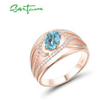 Masivní stříbrný prsten s třpytivými vlny a masivním světle modrým kamenem