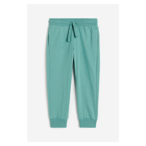 H & M - Žerzejové kalhoty jogger - zelená H&M