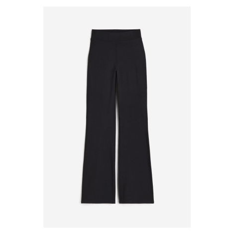 H & M - Sportovní kalhoty Flared z materiálu DryMove™ - černá H&M