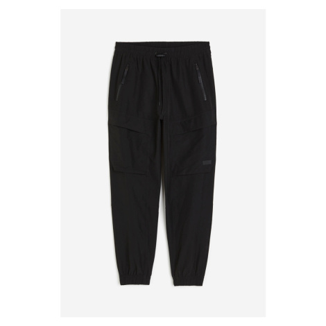 H & M - Sportovní kalhoty jogger cargo - černá H&M